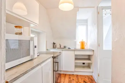 Cuisine ou kitchenette dans l'établissement L'Oasis - Chaleureux duplex - Centre Ville de Caen