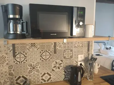 Cuisine ou kitchenette dans l'établissement Authentique studio au cœur de Bayeux