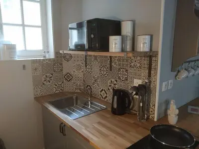 Cuisine ou kitchenette dans l'établissement Authentique studio au cœur de Bayeux