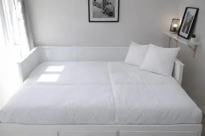 Un ou plusieurs lits dans un hébergement de l'établissement Appartement Cosy Hypercentre CAEN