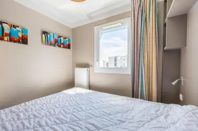 Un ou plusieurs lits dans un hébergement de l'établissement Némo - Appartement avec Terrasse