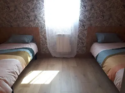 Un ou plusieurs lits dans un hébergement de l'établissement LE CHALET