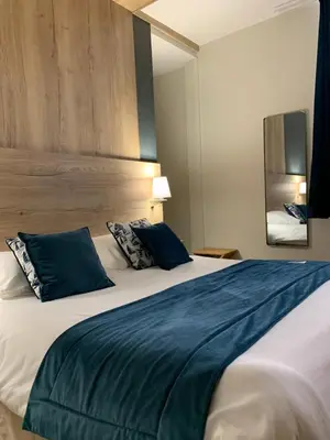 Un ou plusieurs lits dans un hébergement de l'établissement Ambassadeur Hotel - Cherbourg Port de Plaisance