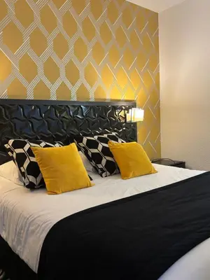 Un ou plusieurs lits dans un hébergement de l'établissement Ambassadeur Hotel - Cherbourg Port de Plaisance