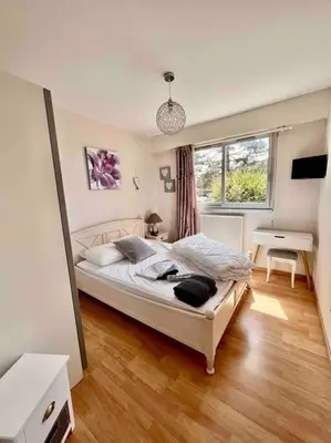 Un ou plusieurs lits dans un hébergement de l'établissement Appartement sur le port.