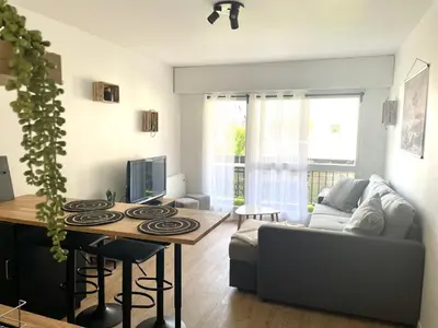 Coin salon dans l'établissement L'échappée Cabourgeaise
