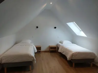 Un ou plusieurs lits dans un hébergement de l'établissement La Cigogne, moderne, spacieux et bien placé