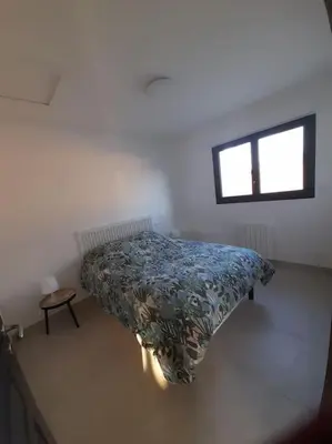 Un ou plusieurs lits dans un hébergement de l'établissement maison neuve a 1 km de la plage