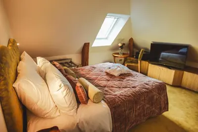 Un ou plusieurs lits dans un hébergement de l'établissement Château Hôtel - Domaine de Coeurmandie