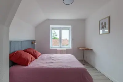 Un ou plusieurs lits dans un hébergement de l'établissement Gîte du Tilleul - Maison climatisée pour 8 voyageurs