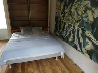 Un ou plusieurs lits dans un hébergement de l'établissement Jolie maison en pierre proche centre-ville