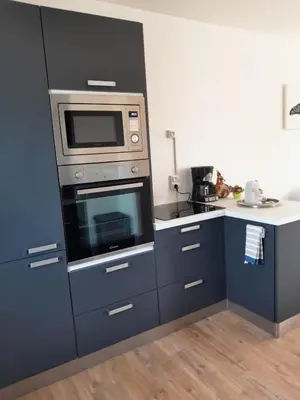 Cuisine ou kitchenette dans l'établissement Maison de vacances Bréhal