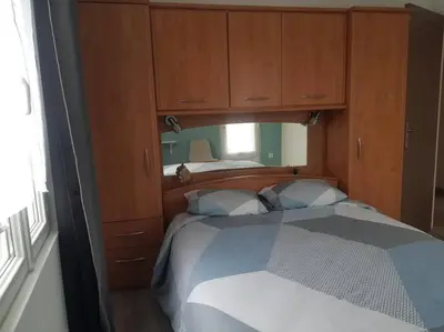 Un ou plusieurs lits dans un hébergement de l'établissement Maison Bateau