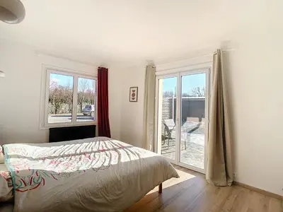 Un ou plusieurs lits dans un hébergement de l'établissement Maison de vacances en famille