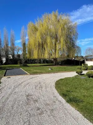 Jardin de l'établissement Maison de vacances en famille