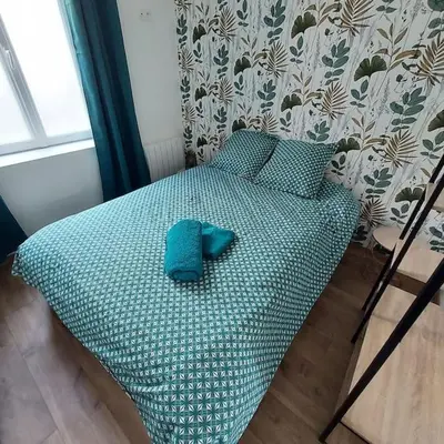 Un ou plusieurs lits dans un hébergement de l'établissement Joli appartement F2 hyper centre
