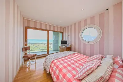Un ou plusieurs lits dans un hébergement de l'établissement Les Mouettes - Maison vue mer