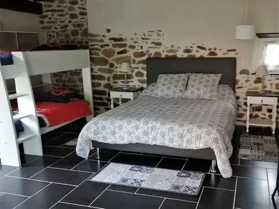 Un ou plusieurs lits dans un hébergement de l'établissement Gîtes des marais du Lozon - Maison à la campagne