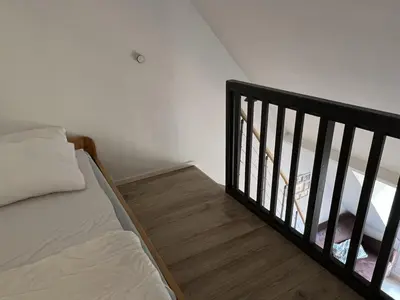Un ou plusieurs lits dans un hébergement de l'établissement Accès direct plage, T3 mezzanine, 4 pers, balcon, parking, proche thalasso à Cabourg - FR-1-487-357