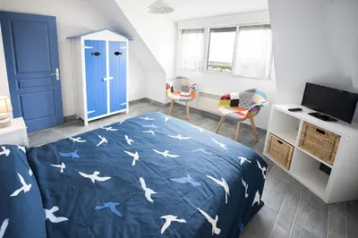Un ou plusieurs lits dans un hébergement de l'établissement Villa Quiné Plage