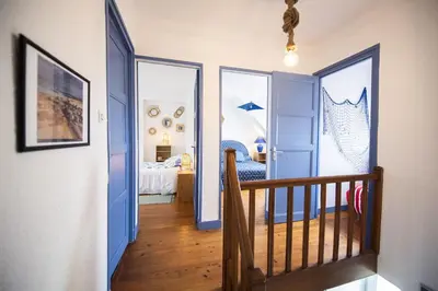Un ou plusieurs lits dans un hébergement de l'établissement Villa Quiné Plage