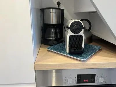 Cuisine ou kitchenette dans l'établissement Charmant Duplex, 300 m de la mer