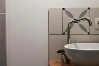 Salle de bains dans l'établissement Duplex accès jacuzzi illimité T