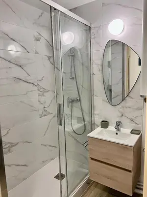 Salle de bains dans l'établissement Plage Cabourg 7 Vue Mer