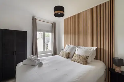 Un ou plusieurs lits dans un hébergement de l'établissement La Maison de Louise - Superbe maison avec patio