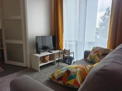Télévision ou salle de divertissement dans l'établissement Gîte PEGASUS - 5 min plage
