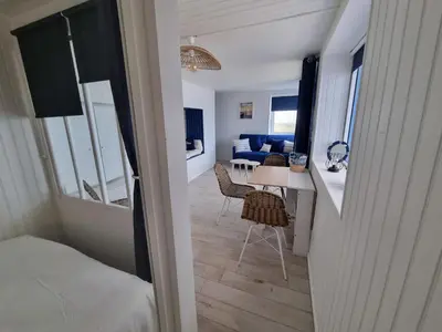 Un ou plusieurs lits dans un hébergement de l'établissement Petite maison avec jardin face mer