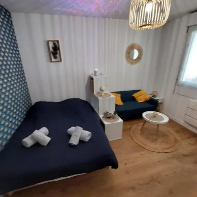 Un ou plusieurs lits dans un hébergement de l'établissement Le Studio Zen 