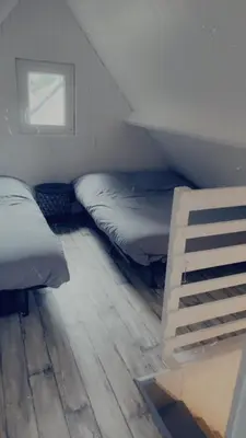 Un ou plusieurs lits dans un hébergement de l'établissement Chalet rénové Cabourg