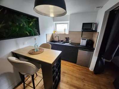 Cuisine ou kitchenette dans l'établissement Caen, Tu m'aimes - Suite Romantique