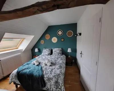 Un ou plusieurs lits dans un hébergement de l'établissement Gîte 200m2 avec spa