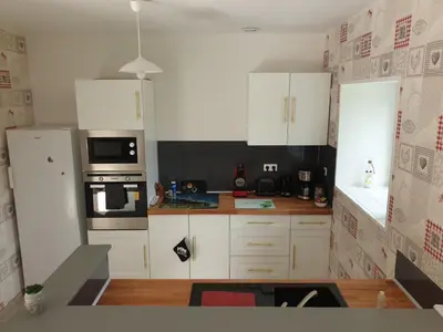 Cuisine ou kitchenette dans l'établissement Ferme de Barville & SPA