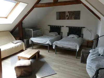 Un ou plusieurs lits dans un hébergement de l'établissement Domaine de Valmeray Gîte