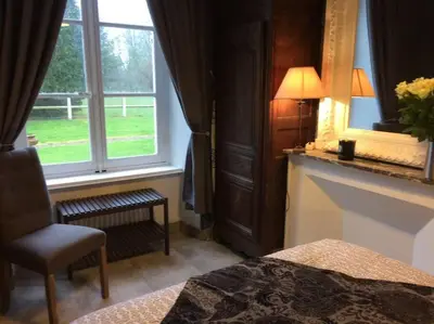 Un ou plusieurs lits dans un hébergement de l'établissement Domaine de Valmeray Gîte