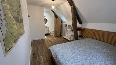 Un ou plusieurs lits dans un hébergement de l'établissement Authentique appartement de charme - Accès direct Voie Verte au coeur de la Suisse Normande