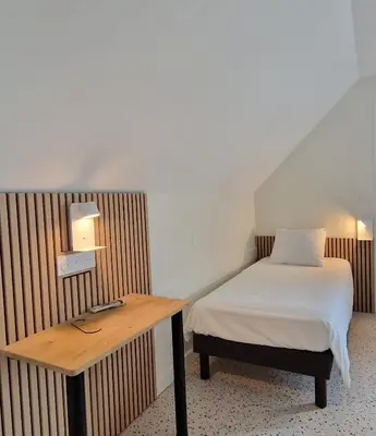 Un ou plusieurs lits dans un hébergement de l'établissement Hotel Eisenhower