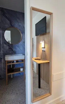 Télévision ou salle de divertissement dans l'établissement Hotel Eisenhower