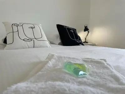 Un ou plusieurs lits dans un hébergement de l'établissement Presqu'île, appartement neuf avec balcon, salle de gym et parking