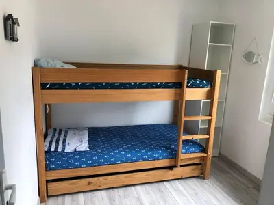 Un ou plusieurs lits dans un hébergement de l'établissement La maison bleue