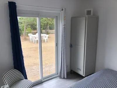 Un ou plusieurs lits dans un hébergement de l'établissement La maison bleue