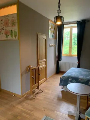 Un ou plusieurs lits dans un hébergement de l'établissement Le Petit Manoir
