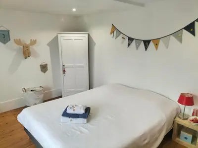 Un ou plusieurs lits dans un hébergement de l'établissement La chambre des Remparts