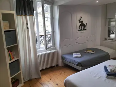 Un ou plusieurs lits dans un hébergement de l'établissement La chambre des Remparts