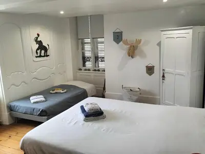 Un ou plusieurs lits dans un hébergement de l'établissement La maison des Remparts