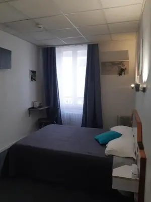 Un ou plusieurs lits dans un hébergement de l'établissement Hôtel de La Croix de Malte
