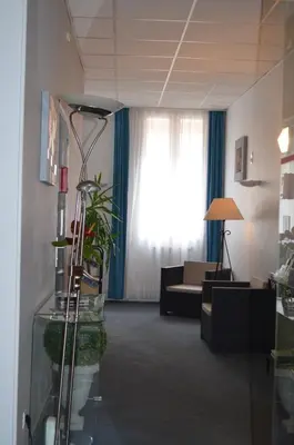 Coin salon dans l'établissement Hôtel de La Croix de Malte